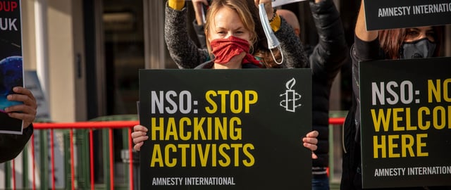 Amnesty International members and supporters demonstrate against the presence of the NSO Group at the International Security Expo in London, 28 September 2021. The NSO Group's Pegasus spyware has been used to target human rights defenders, journalists and Amnesty staff. In July 2021 Amnesty launched the Pegasus Project, an in-depth investigation in collaboration with the Forbidden Stories network of journalists which exposes the global scale of abuses involving NSO Group. The investigation looked into the leak of 50,000 phone numbers of potential surveillance targets, including heads of state, HRDs and journalists.   Despite NSO Group’s track record of supplying is surveillance tools to governments whom have repeatedly misused them to target HRDs and civil society, they are still being allowed to exhibit their wares with no accountability. The Expo’s advisory committee includes several high-level UK policing and intelligence officials. NSO Group has still been invited despite a number of British residents having been targeted / selected for potential targeting through the use of Pegasus in recent years.
