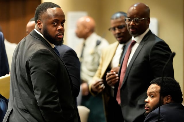 Former Memphis Police Officers Tedarrius Bean, left, and Demetrius Haley, right, two of three former Memphis officers charged with fatally beating Tyre Nichols in 2023, wait in the courtroom during a recess of their trial, Wednesday, April 30, 2025, in Memphis, Tenn. (George Walker IV/Pool)