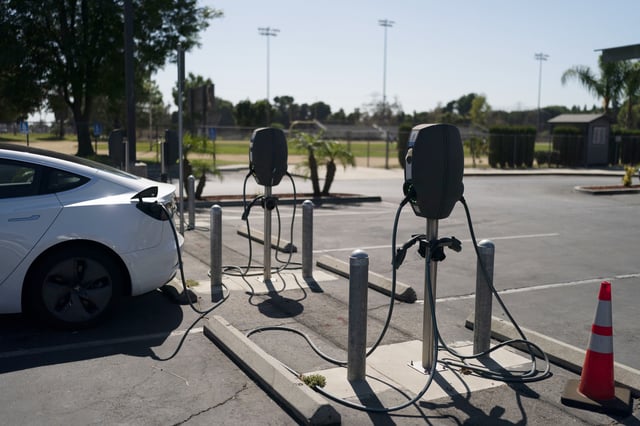 FILE - Electric vehicle chargers are seen in the parking lot of South El Monte High School in South El Monte, Calif., Aug. 26, 2022. (AP Photo/Jae C. Hong, File)