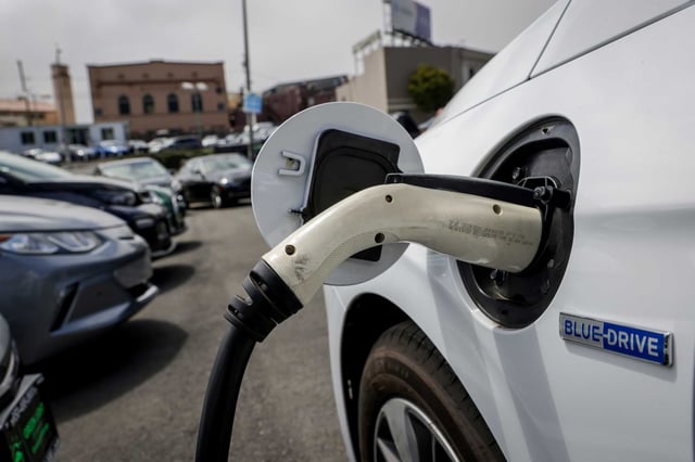 An electric vehicle charges in Daly City in 2022.
