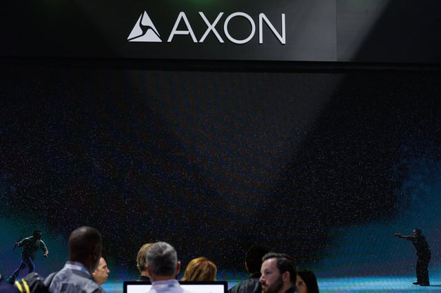 People gathers at the Axon booth on the exhibit floor during the annual International Association of Chiefs of Police (IACP) conference in San Diego, California, U.S.,October 16, 2023. REUTERS/Mike Blake