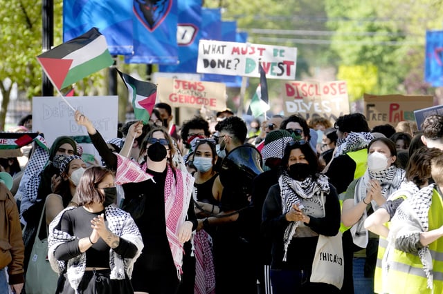 FILE- Pro-Palestinian protesters demonstrate on the campus of DePaul University, April 30, 2024, in Chicago. (AP Photo/Charles Rex Arbogast, file)
