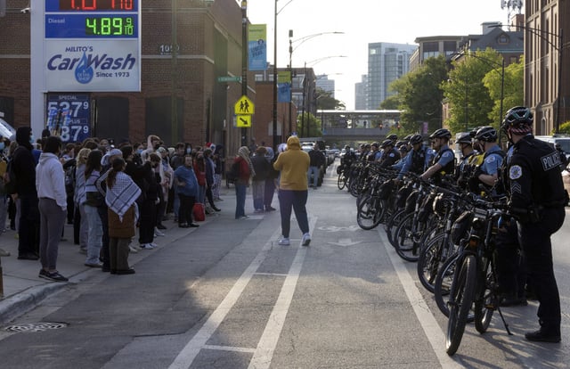 FILE - Protesters face off with Chicago police across the street from DePaul University in Chicago, May 16, 2024. (AP Photo/Teresa Crawford, file)