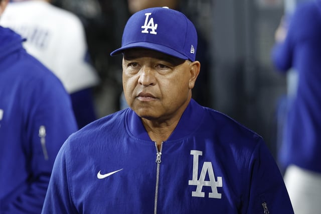 LOS ANGELES, CALIFORNIA - APRIL 28: Manager Dave Roberts #30 of the Los Angeles Dodgers walks through the dugout in the fourth inning during a game against the Miami Marlins at Dodger Stadium on April 28, 2025 in Los Angeles, California.