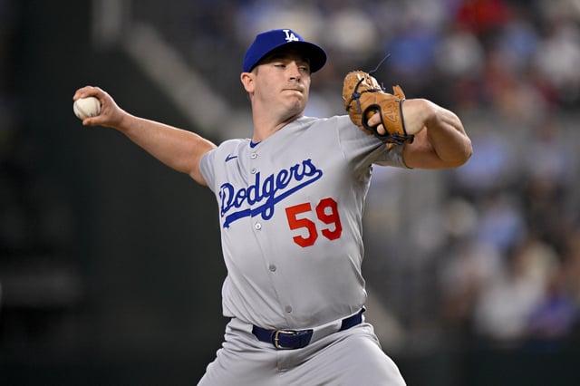 Apr 20, 2025; Arlington, Texas, USA; Los Angeles Dodgers relief pitcher Evan Phillips (59) pitches during the game between the Texas Rangers and the Los Angeles Dodgers at Globe Life Field. Mandatory Credit: Jerome Miron-Imagn Images/File Photo