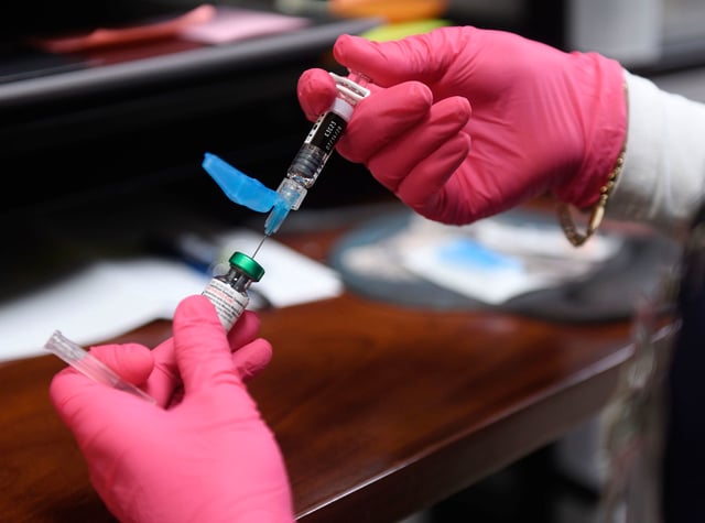 A measles, mumps and rubella vaccine is prepared at the Andrews County Health Department in Andrews, Texas, on April 8.