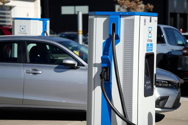 FILE – A charging station outside a Honda dealership on Nov. 12, 2023, in Highlands Ranch, Colo. The Biden administration is awarding $623 million in grants to help build an electric vehicle charging network across the nation. Grants being announced Thursday will fund 47 EV charging stations and related projects in 22 states and Puerto Rico, including 7,500 EV charging ports. (AP Photo/David Zalubowski, File)