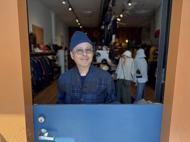 Howard Gee, owner of North Beach’s AB Fits, stands in the doorway of his shop on Grant Avenue.