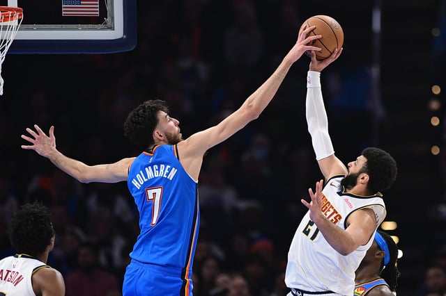 Chet Holmgren #7 of the Oklahoma City Thunder blocks the shot of Jamal Murray #27 of the Denver Nuggets during the first half at Paycom Center on January 31, 2024 in Oklahoma City, Oklahoma.