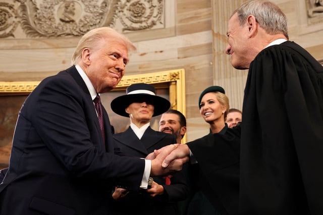 U.S. President Donald Trump shakes hands with U.S. Supreme Court Chief Justice John Roberts (R) as Melania Trump, Donald Trump Jr. and Ivanka Trump look on after being sworn in during inauguration ceremonies in the Rotunda of the U.S. Capitol on January 20, 2025 in Washington, DC. Chip Somodevilla/Pool via REUTERS/File Photo