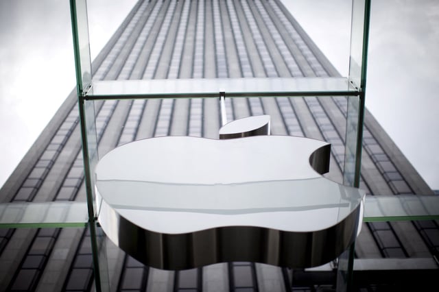 An Apple logo hangs above the entrance to the Apple store on 5th Avenue in the Manhattan borough of New York City, July 21, 2015. REUTERS/Mike Segar/File Photo