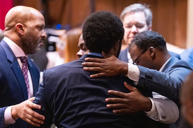 Former Memphis Police Department officers Demetrius Haley, center, Tadarrius Bean, left, and Justin Smith Jr., right, hug each other after they were acquitted of state charges, including second-degree murder, in the fatal beating of Tyre Nichols after he ran away from a traffic stop. Wednesday, May 7, 2025, in Memphis, Tenn. (Chris Day/Commercial Appeal/USA Today Network via AP, Pool)