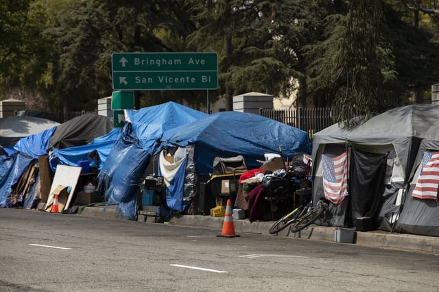 A homeless encampment sits on a street in Downtown Los Angeles, California, USA.