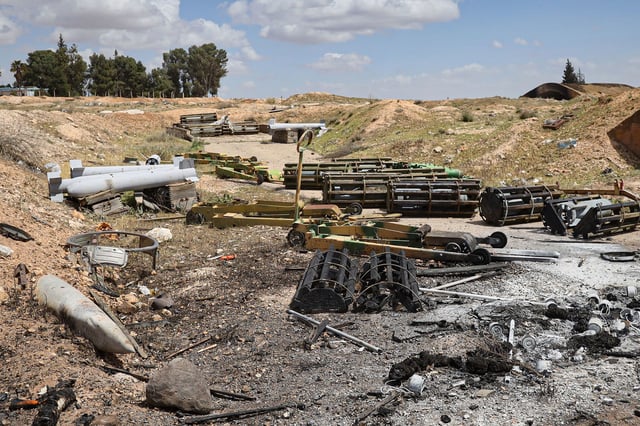 Debris is scattered at the site of an Israeli strike on a military airbase near Hama, Syria, on April 3.