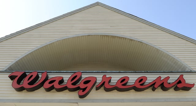 File photo of a sign above a Walgreens entrance in Gloucester, Mass., taken in 2009.