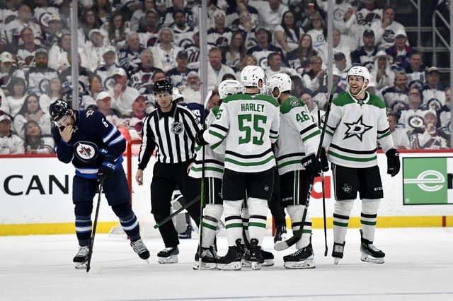 Dallas Stars' Mikko Rantanen (right) celebrates his goal against the Winnipeg Jets with teammates during second period NHL playoff hockey action in Winnipeg, Wednesday, May 7, 2025. THE CANADIAN PRESS/Fred Greenslade