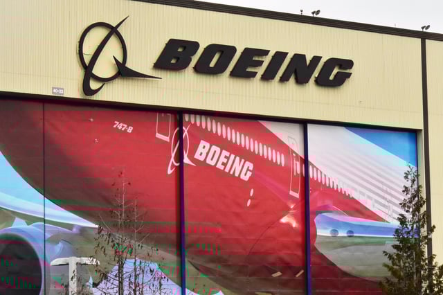 Boeing Co's logo is seen above the front doors of its largest jetliner factory in Everett, Washington, U.S. January 13, 2017. REUTERS/Alwyn Scott/File Photo