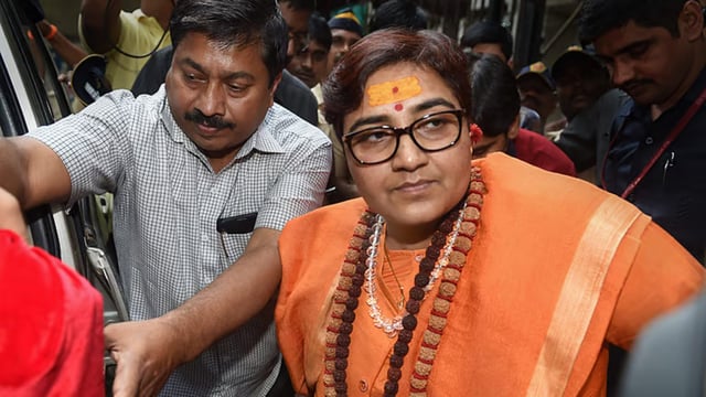 Former BJP parliamentarian Sadhvi Pragya Singh Thakur, an accused in the case, leaving the special court in 2018. (PTI/File)