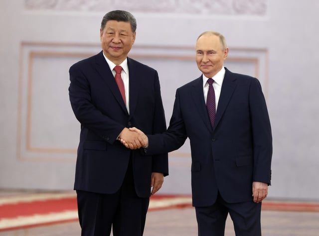 Russian President Vladimir Putin (R) shakes hands with Chinese President Xi Jinping (L) during their meeting at the Grand Kremlin Palace, on May 8, 2025 in Moscow, Russia.