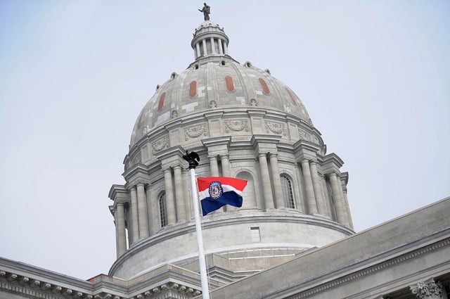 The Missouri state flag is seen flying outside the Missouri State Capitol Building in Jefferson City. (Michael B. Thomas/Getty Images North America/TNS)