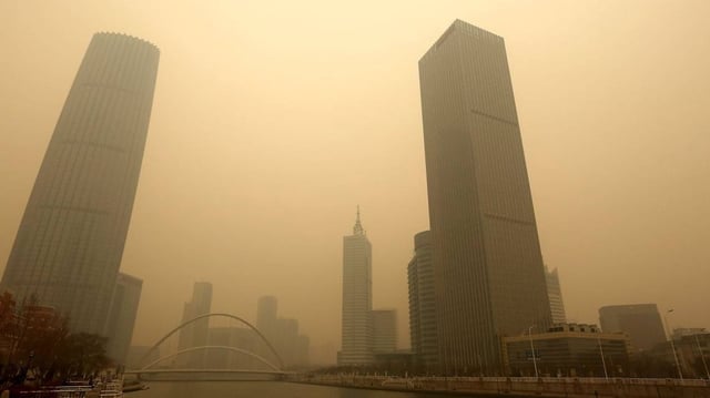A heavy, hazardous smog hangs over downtown Tianjin, a port city just east of Beijing, in February 2017. A study released Thursday links air pollution and other byproducts of economic growth in Asia and Oceania to rapidly rising rates of ischemic heart disease. File Photo by Stephen Shaver/UPI