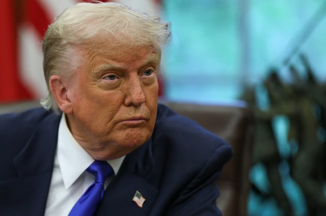 U.S. President Donald Trump looks on as he signs executive orders and proclamations in the Oval Office at the White House, in Washington, D.C., U.S., May 5, 2025. REUTERS/Leah Millis/File Photo