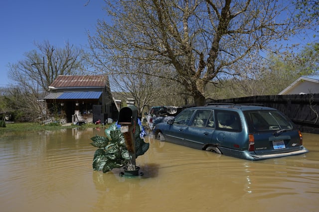 FILE - A home is flooded by the Kentucky River, Lockport, Ky., Tuesday, April 8, 2025. (AP Photo/Carolyn Kaster, File)