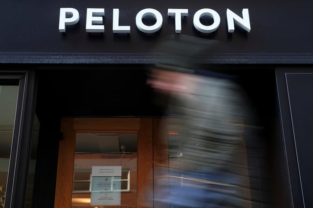 A person walks past a Peloton store in the Manhattan borough of New York City, U.S., January 25, 2022.  REUTERS/Carlo Allegri/File photo