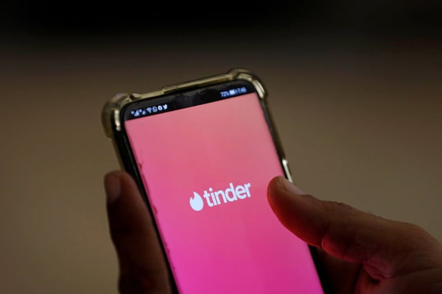The dating app Tinder is shown on a mobile phone in this picture illustration taken September 1, 2020. REUTERS/Akhtar Soomro/Illustration/File Photo