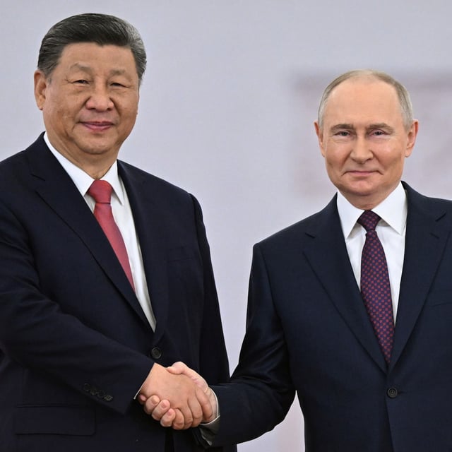 CORRECTS DATE - Russian President Vladimir Putin, right, and his Chinese counterpart Xi Jinping shake hands during a welcoming ceremony before their talks at the Kremlin in Moscow, Russia, Thursday, May 8, 2025, ahead of celebrations of the 80th anniversary of the Soviet Union's victory over Nazi Germany during the World War II. (Sergey Bobylev/Photo host agency RIA Novosti via AP)