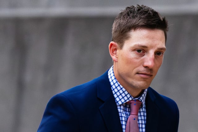 Former Grand Rapids Police officer Christopher Schurr enters the Kent County Courthouse in Grand Rapids, Mich., on May 2, 2025. 