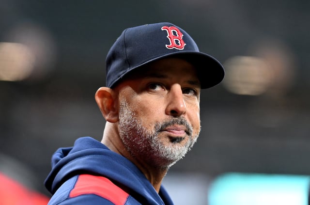 BALTIMORE, MARYLAND - APRIL 02: Manager Alex Cora #13 of the Boston Red Sox watches the game against the Baltimore Orioles at Oriole Park at Camden Yards on April 02, 2025 in Baltimore, Maryland. (Photo by G Fiume/Getty Images)