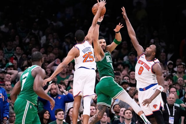 New York Knicks forward Mikal Bridges (25) blocks a pass by Boston Celtics forward Jayson Tatum in the final seconds of the second half of Game 2 of an NBA basketball second-round playoff series, Wednesday, May 7, 2025, in Boston. (AP Photo/Charles Krupa)