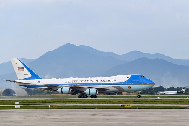Air Force One landing in a 2023 photo. Boeing has moved up the planned delivery time of two 747 jets  to replace the two current jets. But the delivery will still come years after originally scheduled.