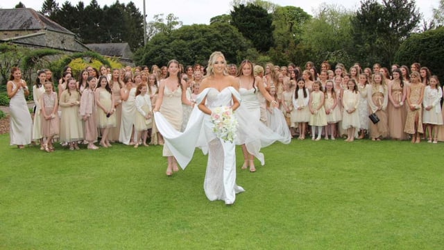 Kathryn McGowan tied the knot with 95 bridesmaids in attendance