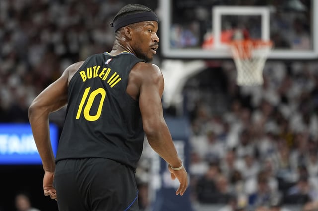 Golden State Warriors forward Jimmy Butler III (10) jogs down the court during the first half of Game 1 of an NBA basketball second-round playoff series against the Minnesota Timberwolves, Tuesday, May 6, 2025, in Minneapolis. (AP Photo/Abbie Parr)