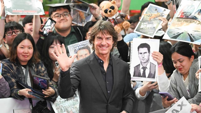 Tom Cruise poses for a photo during a red carpet event for the film Mission: Impossible The Final Reckoning in Seoul. (Photo by Jung Yeon-je / AFP)