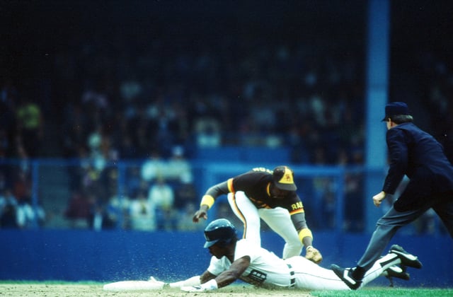 Chet Lemon of the Detroit Tigers slides under the tag of Alan Wiggins at second base during World Series game three between the San Diego Padres and Detroit Tigers on October 12, 1984 at Tiger Stadium in Detroit, Michigan.