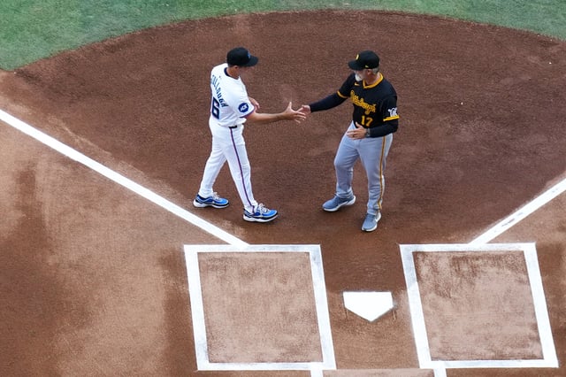 Clayton McCullough #86 manager of the Miami Marlins and Derek Shelton #17 manager of the Pittsburgh Pirates meet prior to the game at loanDepot park on March 27, 2025 in Miami.