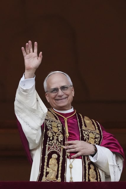 Newly elected Pope Leo XIV appears at the balcony of St. Peter's Basilica at the Vatican, Thursday, May 8, 2025. (AP Photo/Alessandra Tarantino)