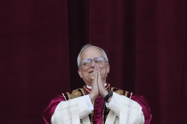 Newly elected Pope Leo XIV appears at the balcony of St. Peter's Basilica at the Vatican, Thursday, May 8, 2025. (AP Photo/Alessandra Tarantino)