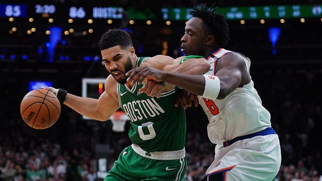 May 7, 2025; Boston, Massachusetts, USA; New York Knicks forward OG Anunoby (8) defends against Boston Celtics forward Jayson Tatum (0) in the fourth quarter during game two of the second round for the 2025 NBA Playoffs at TD Garden.