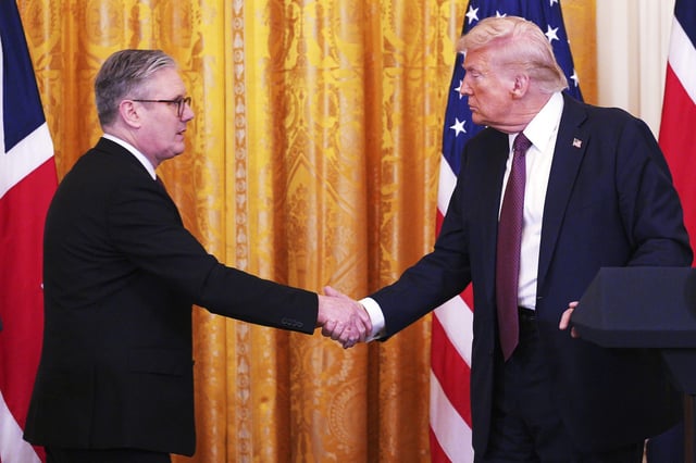 Britain's Prime Minister Keir Starmer, left, and U.S. President Donald Trump shake hands at a joint press conference in the East Room at the White House Thursday, Feb. 27, 2025, in Washington. (Carl Court/Pool Photo via AP)