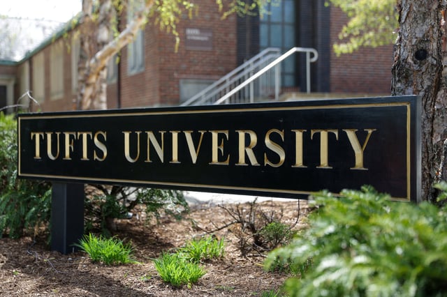 A sign stands at the edge of the main campus of Tufts University, in Medford, Massachusetts, U.S., April 29, 2025.  REUTERS/Taylor Coester/File Photo