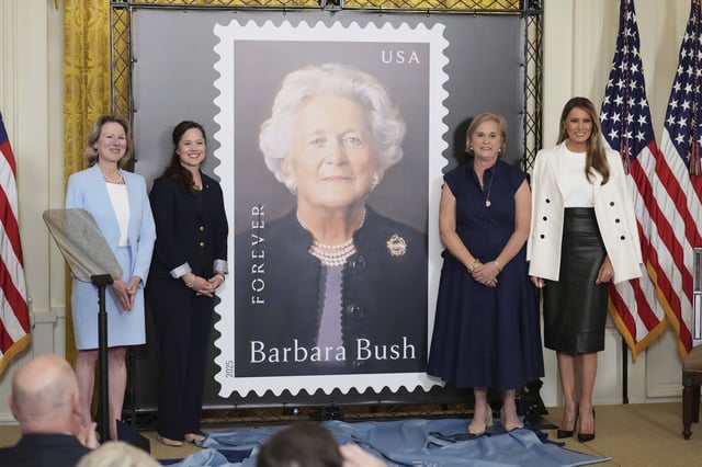 First lady Melania Trump, from right, Dorothy Bush Koch, Alice Gonzalez Yates, CEO of the George and Barbara Bush Foundation, and Judy de Torok, vice president of corporate affairs at the U.S. Postal Service, unveil a U.S. Postal Service Stamp honoring former first lady Barbara Bush, Thursday, May 8, 2025, in the East Room of the White House in Washington. (AP Photo/Jacquelyn Martin)