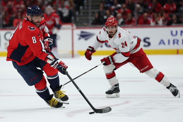 Alex Ovechkin #8 of the Washington Capitals skates with the puck against the Carolina Hurricanes at Capital One Arena on April 10, 2025 in Washington, DC.