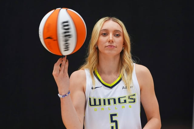 Dallas Wings guard Paige Bueckers poses for photos during a WNBA basketball media day in Arlington, Texas, Wednesday, May 7, 2025. (AP Photo/LM Otero)