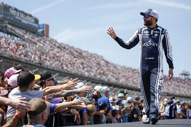 Ross Chastain, driver of the #1 Jockey Chevrolet, waves to fans as he walks onstage during driver intros prior to the NASCAR Cup Series Jack Link&#39;s 500 at Talladega Superspeedway on April 27, 2025 in Talladega, Alabama.