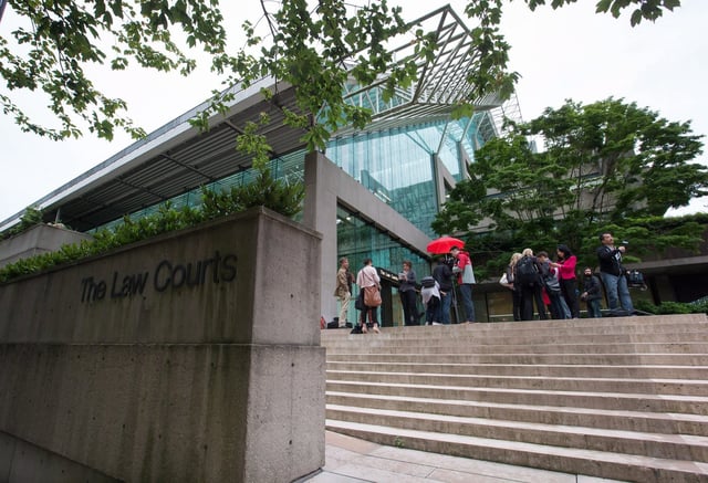 Media wait outside court in Vancouver, on June 2, 2015. THE CANADIAN PRESS/Darryl Dyck