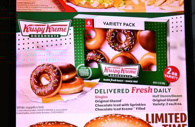 Krispy Kreme menu offerings seen at a McDonald's drive-thru in November 2024, months after the partnership was first announced.